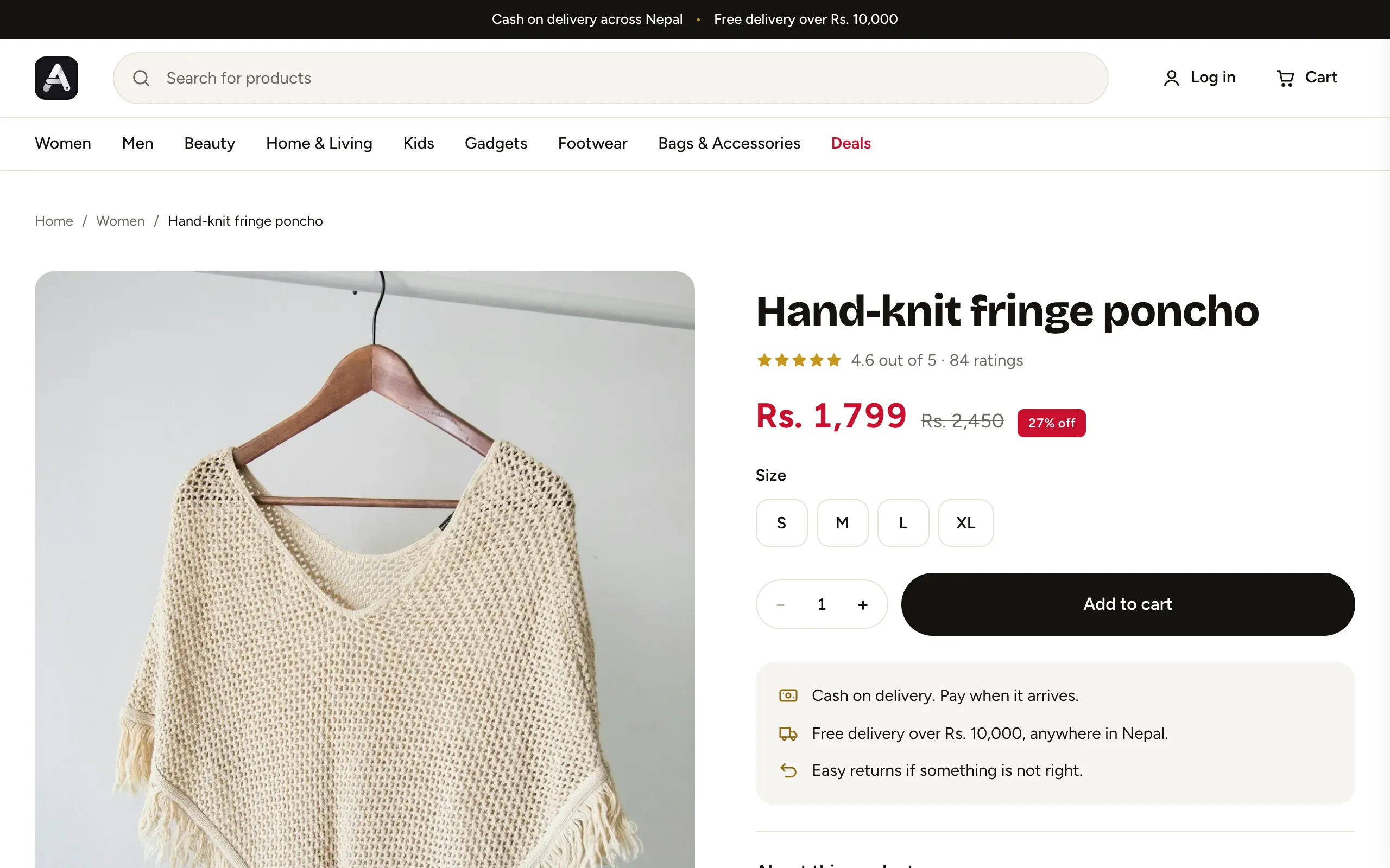 Product page for a hand-knit poncho with a sale price, sizes and an Add to cart button