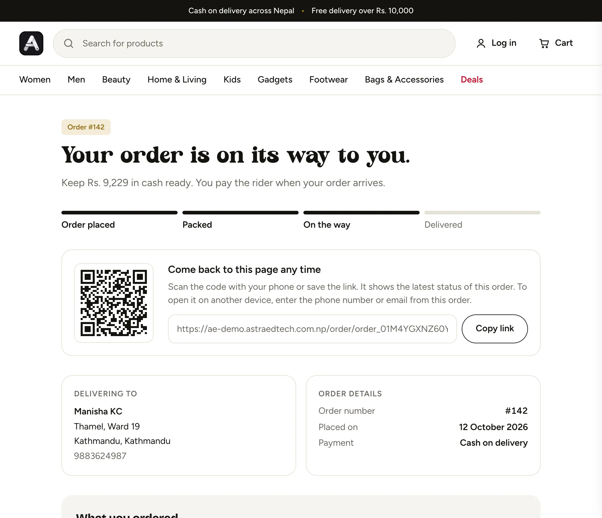 Order tracking page saying the order is on its way, with progress steps and a QR code
